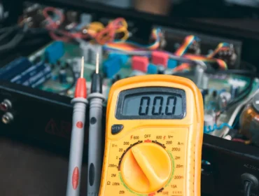 A digital multimeter used for checking voltage during electrical appliance inspections for PAT testing.