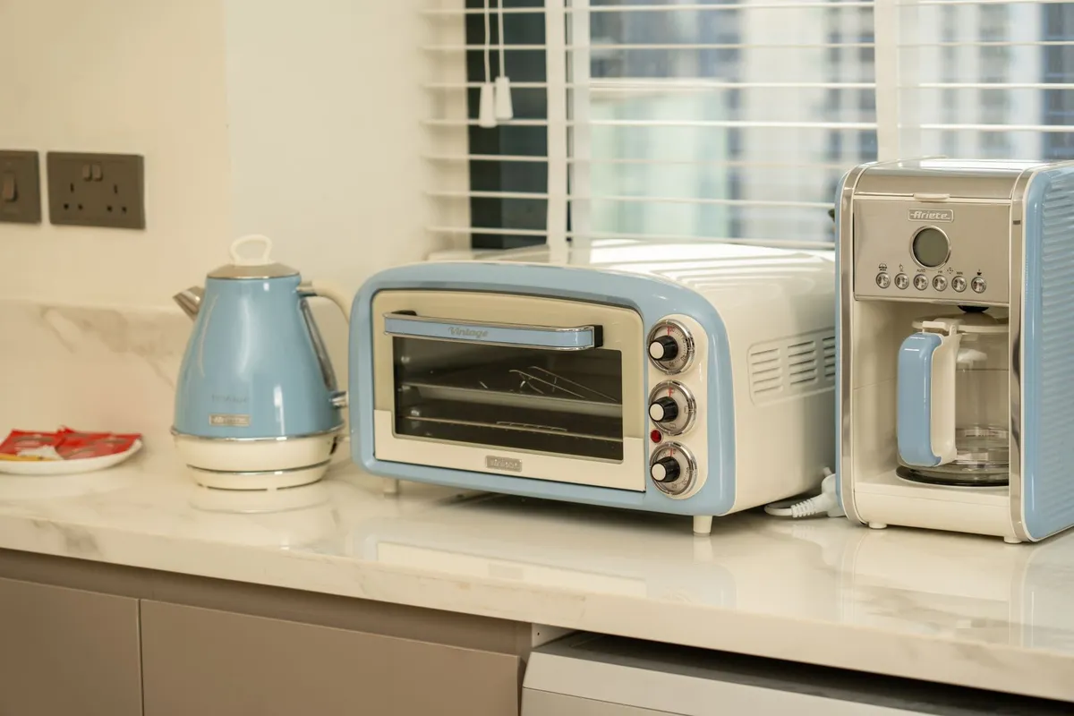Retro-style kitchen appliances in a modern setting with blue accents, highlighting the importance of safety in businesses.